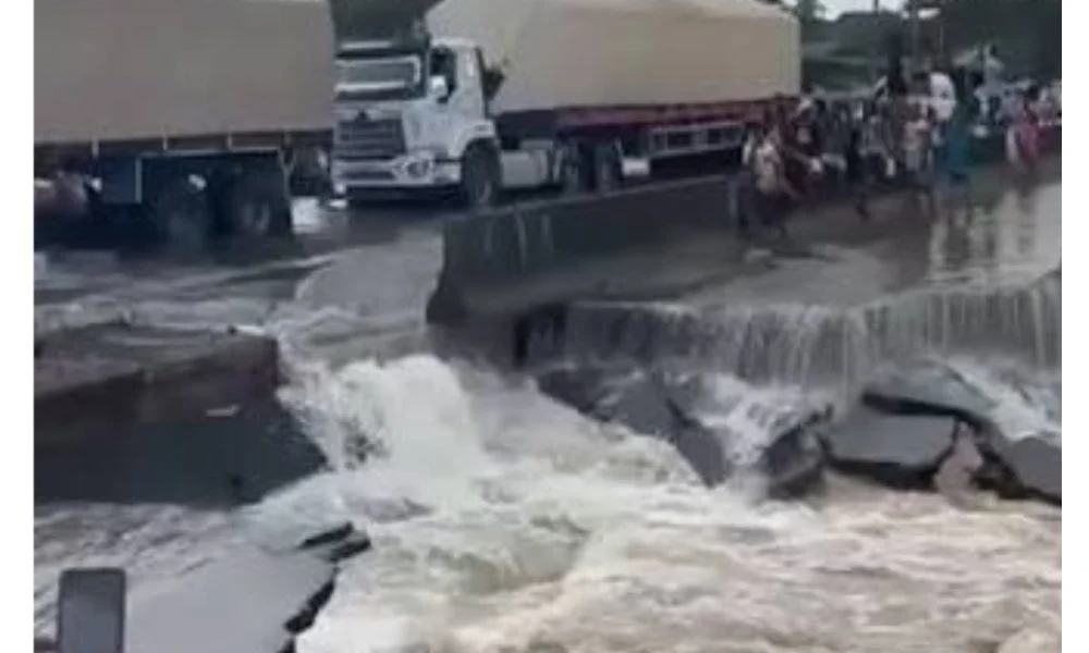East-West Road flooding damages a section of the highway in Agbarho, Delta State